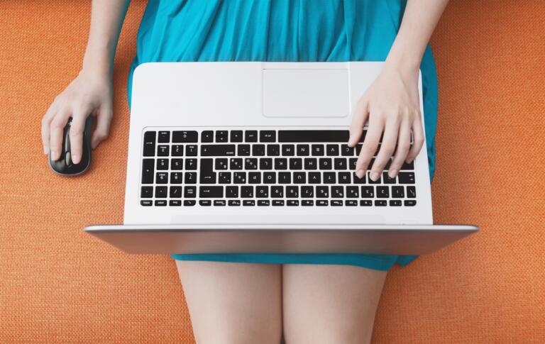 Woman Researching on Laptop