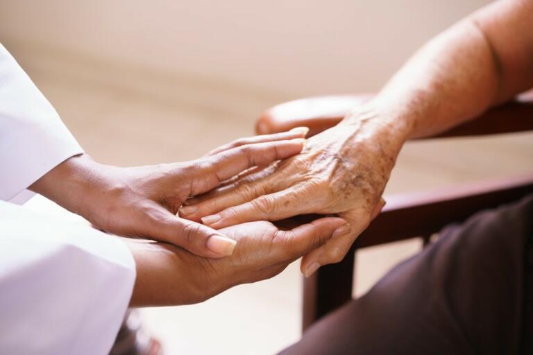 Physician comforting patient before treatment.