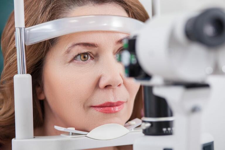 female patient having vision checked during comprehensive eye examination