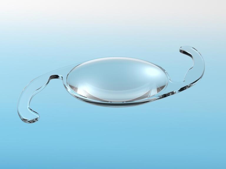 intraocular lens isolated on blue background