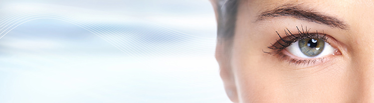 Young woman eyes close-up looking on abstract background