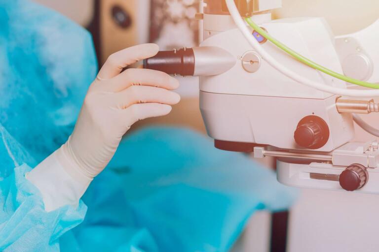 eye doctor preparing patient for LASIK laser eye surgery