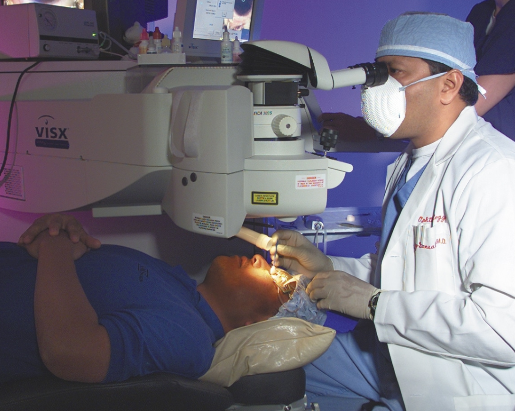 Dr. Jay Bansal at LaserVue Eye Center providing laser vision correction surgery to a patient