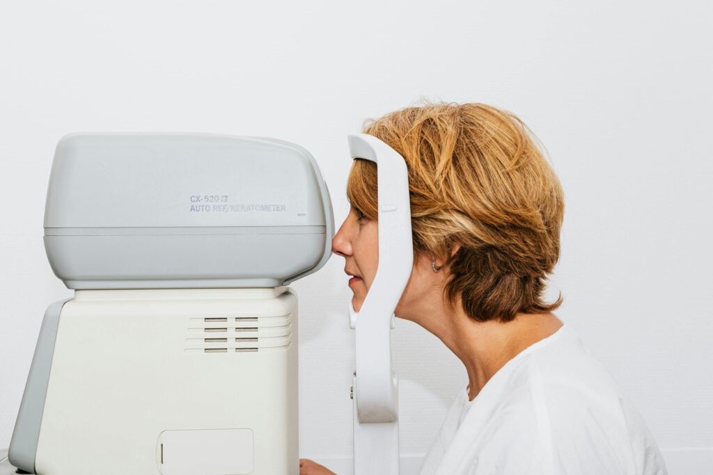 Patient at an autorefractor during an eye exam
