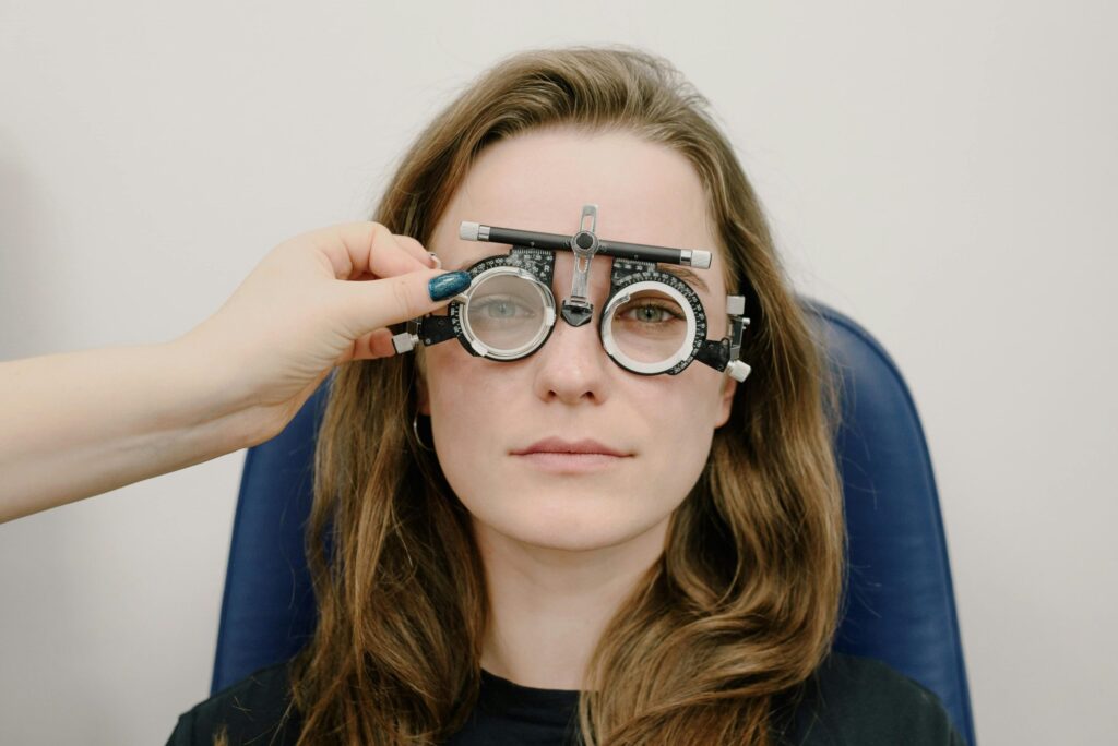 Young woman wearing optometric trial frames