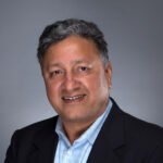 Portrait of Dr. Jay Bansal in a dark suit