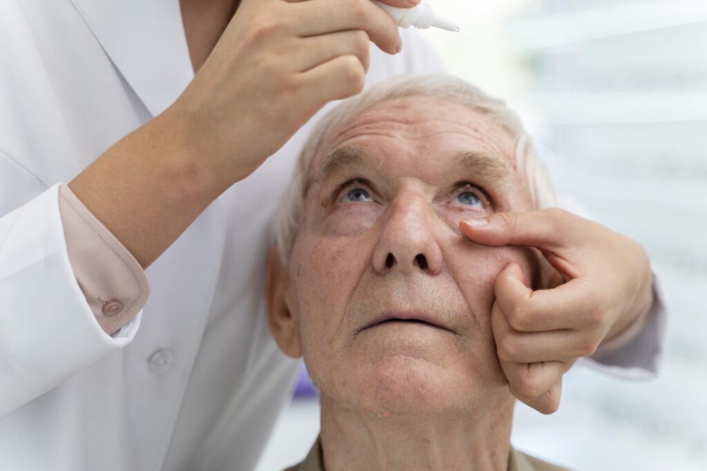 doctor pouring some eye drops patient scaled.jpg