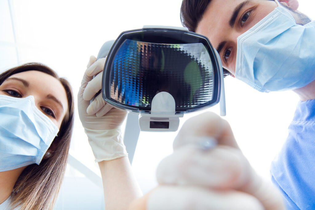 Cute young woman at the dentist. Mouth checkup