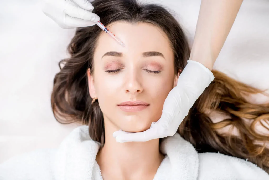 Woman receiving a cosmetic facial treatment