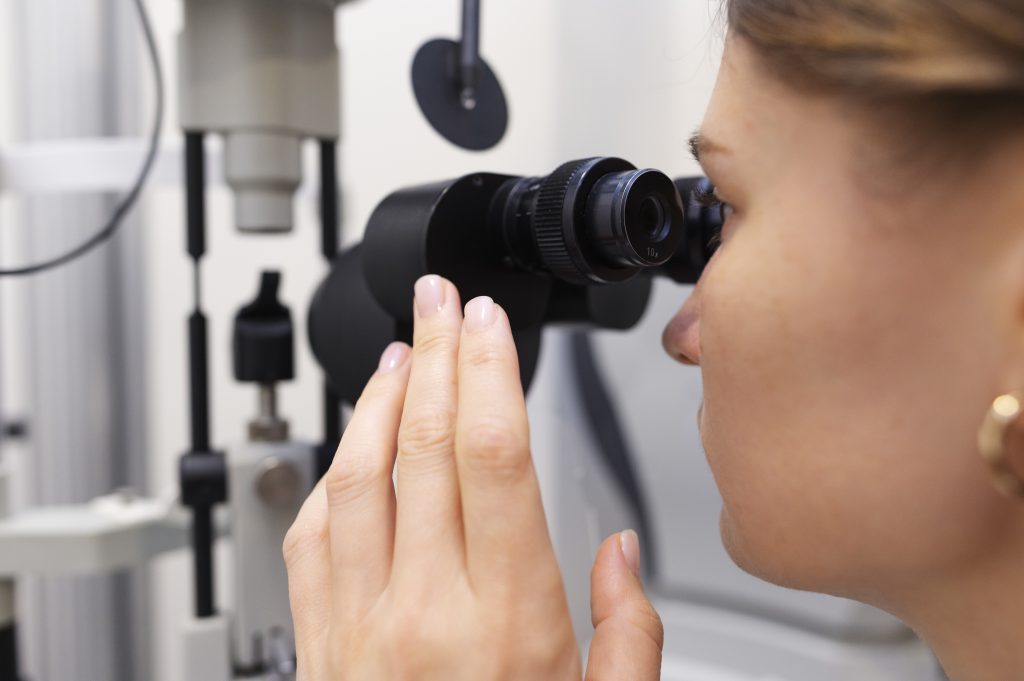 Patient viewed through ophthalmic examination equipment