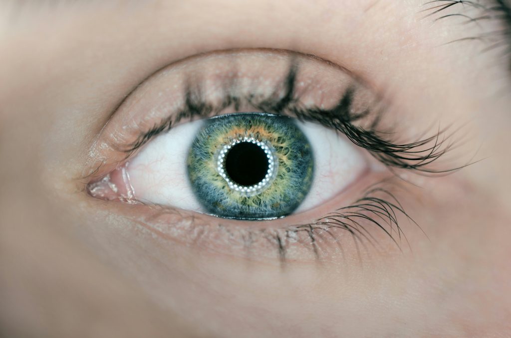 Close-up of a human eye with a blue-green iris