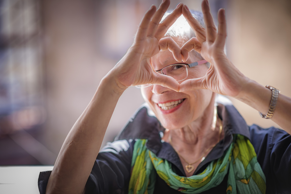 Woman making heart shape with her hands